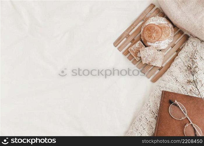 pastry eyeglasses book plaid lying white bedsheet