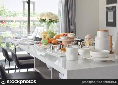 Pastry on the white artificial stone top dining table in the modern dining room