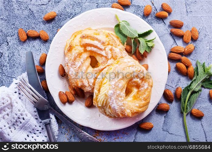 pastry rings with cream on the plate