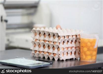 Pastry shop kitchen background, eggs, yolks, weight scale and laminator machine .. Pastry shop kitchen background, eggs, yolks, weight scale and laminator machine.