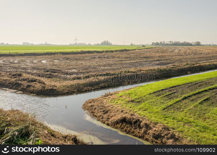 Pastures and water in backlight.