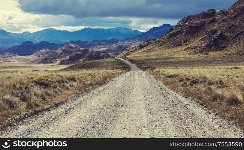 Patagonia landscapes in Southern Argentina. Gravel road in prairie at sunset.