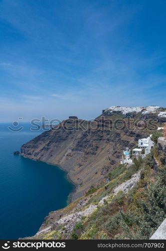 Pathway on cliff to Imerovigli and Firostefani above village of Fira on Santorini. Pathway to Imervigli via cliff in Fira Santorini