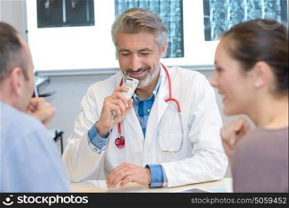 patient and doctor laughing