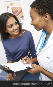 Patient and female doctor smiling