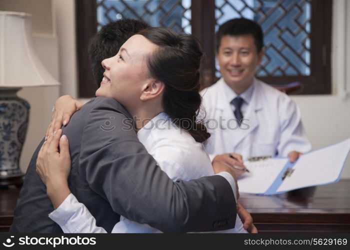 Patient and Spouse Hug at the Good News