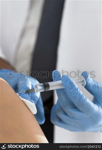 patient being vaccinated by doctor