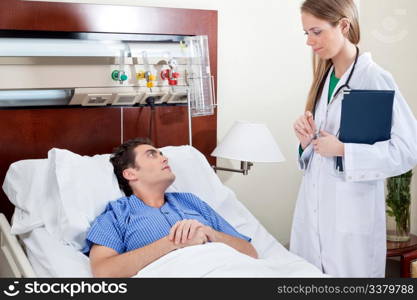 Patient consulting doctor in hospital room