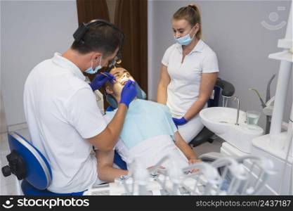 patient dentist getting procedure done