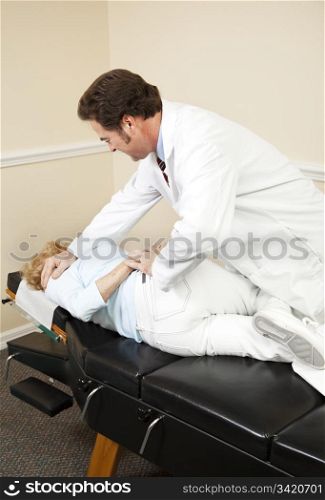 Patient getting a spinal adjustment from her chiropractor.
