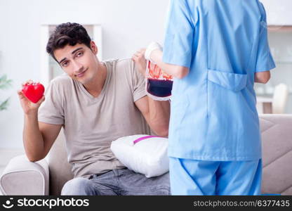 Patient getting blood transfusion in hospital clinic