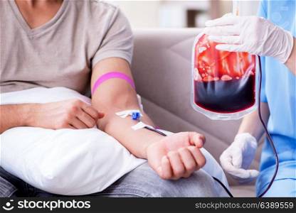 Patient getting blood transfusion in hospital clinic