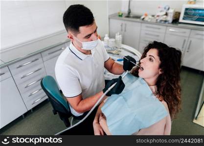 patient getting teeth cleaning dentist