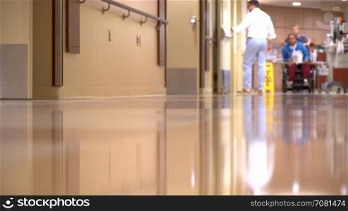 Patient is wheeled down a hall