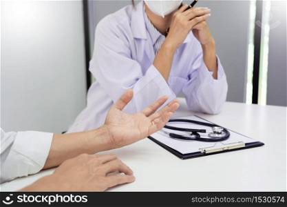 patient listening intently to doctor explaining symptoms medical informations prevention diseases and diagnosis, in medical clinic or hospital healthcare service center