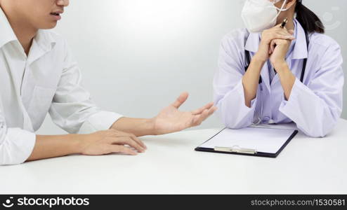 patient listening intently to doctor explaining symptoms medical informations prevention diseases and diagnosis, in medical clinic or hospital healthcare service center