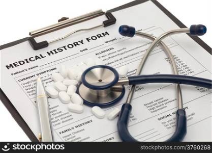 Patient medical history document with pills and stethoscope