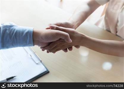 patient shaking hands with doctor as a thank you gesture