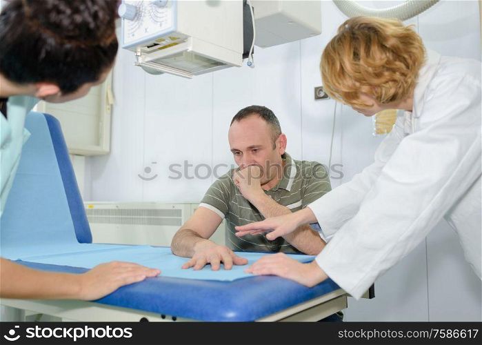 patient undergoing scan test in hospital room