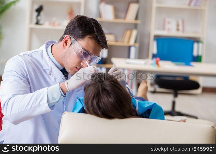 Patient visiting dentist for regular check-up and filling