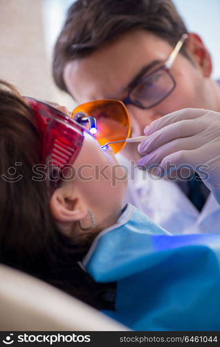 Patient visiting dentist for regular check-up and filling