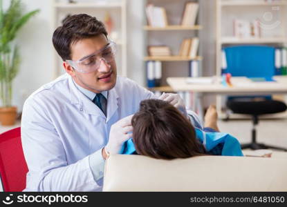 Patient visiting dentist for regular check-up and filling