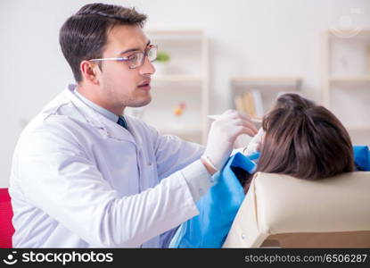 Patient visiting dentist for regular check-up and filling