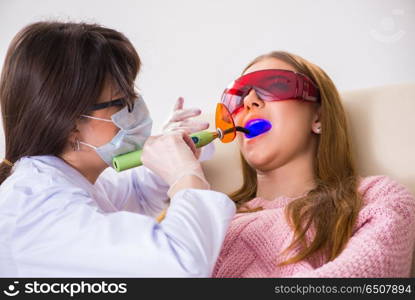 Patient visiting dentist for regular check-up and filling