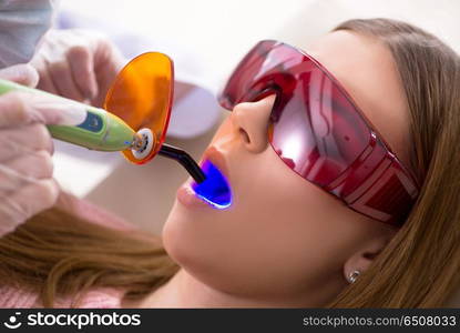 Patient visiting dentist for regular check-up and filling