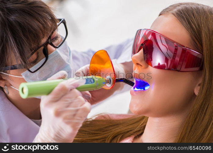 Patient visiting dentist for regular check-up and filling