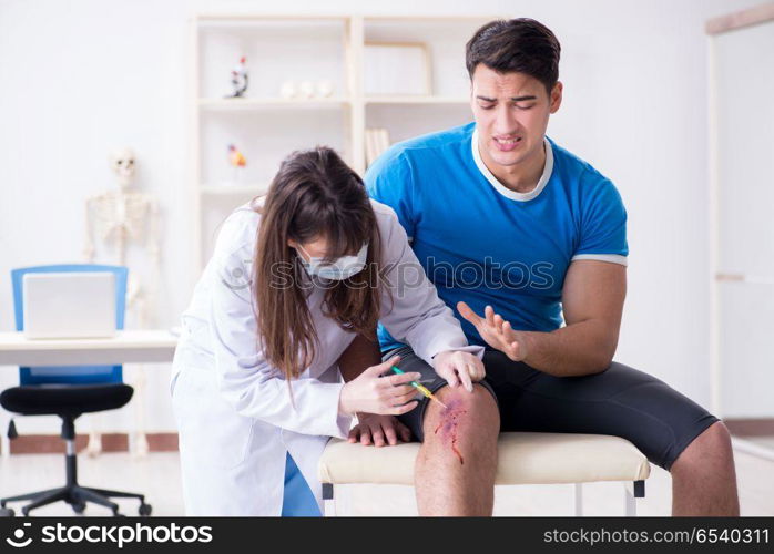 Patient visiting doctor after sustaining sports injury