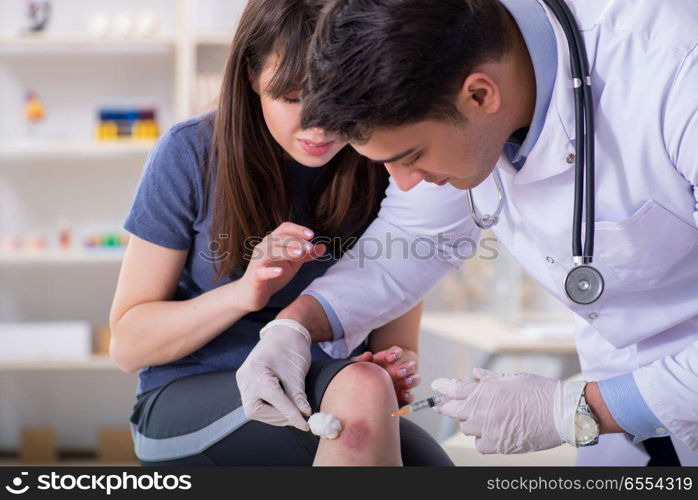 Patient visiting doctor after sustaining sports injury