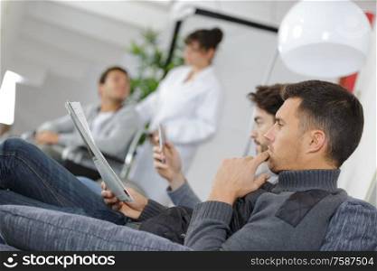 patients in doctors waiting room