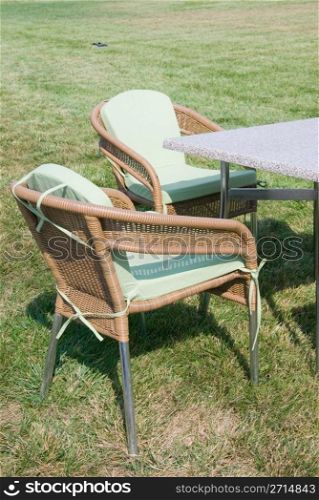 Patio furniture on green lawn
