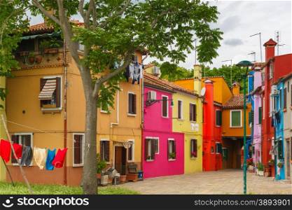 Patio with colorful houses on the famous island Burano, Venice, Italy