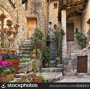 Patio with flowers in the old village Gourdon, France