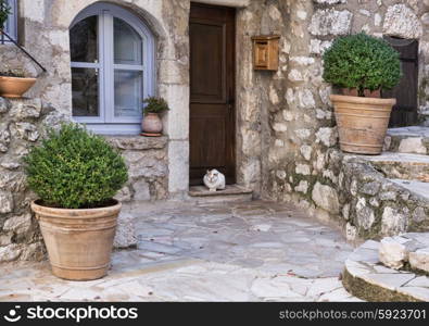 Patio with flowers in the old village Gourdon, France