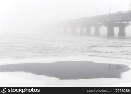 Paton bridge in the foggy day. Kiev. Ukraine