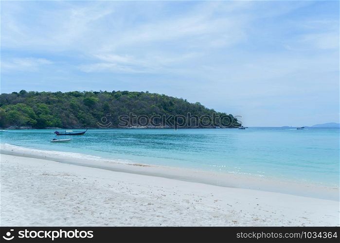 Patong beach, Phuket island and blue sea in summer season, and urban city with sky clouds in travel trip and holidays vacation background, Andaman ocean, Thailand. Tourist attraction.