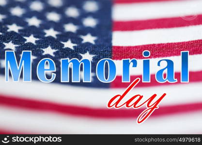 patriotism and national holidays concept - memorial day words over american flag. memorial day words over american flag