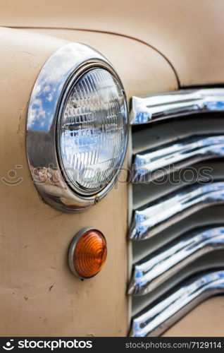 PATTAYA, JANUARY 9 : Color detail on the headlight of a vintage car on sheep a farm on January 9, 2016 in Pattaya, Chonburi province.