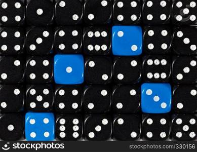 Pattern background of random ordered black dices with four blue cubes. Background of random ordered black dices with four blue cubes