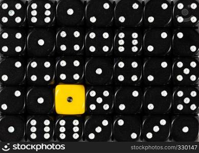 Pattern background of random ordered black dices with one yellow cube. Background of random ordered black dices with one yellow cube
