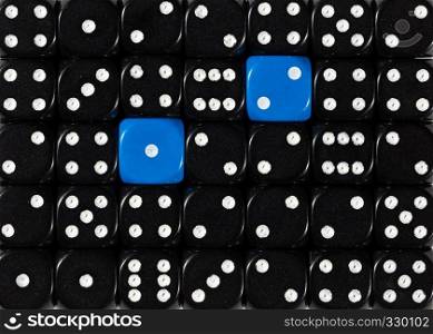 Pattern background of random ordered black dices with two blue cubes. Background of random ordered black dices with two blue cubes