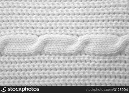 pattern from white soft threads lies on table