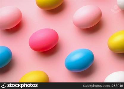 Pattern made of eggs on pastel pink background, minimal easter concept
