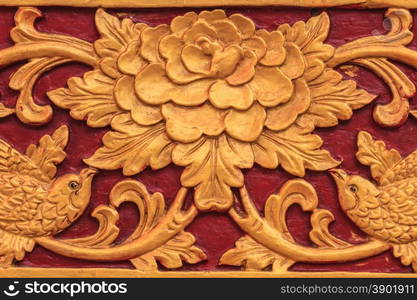 Pattern of flower carved on wood background