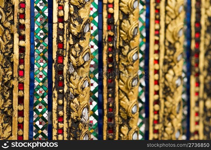Pattern of mirror mosaic on the wall in Grand palace, Bangkok, Thailand