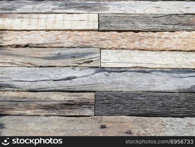 pattern of natural timber on the floor- gray and brown weathered. pattern of natural timber on the floor- gray and brown weathered sawed wood log with cracks, natural texture background
