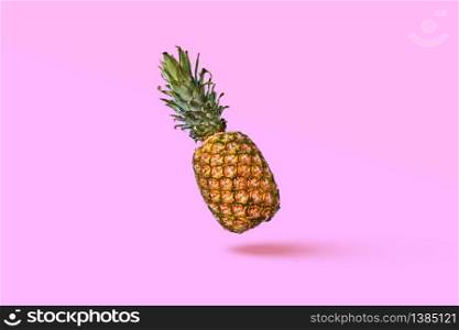 Pattern of slices and whole tropical pineapple fruit on a blue background with space for text. Flat lay. Food composition of ripe pineapple and halved fruit on a blue background with space for text. Flat lay